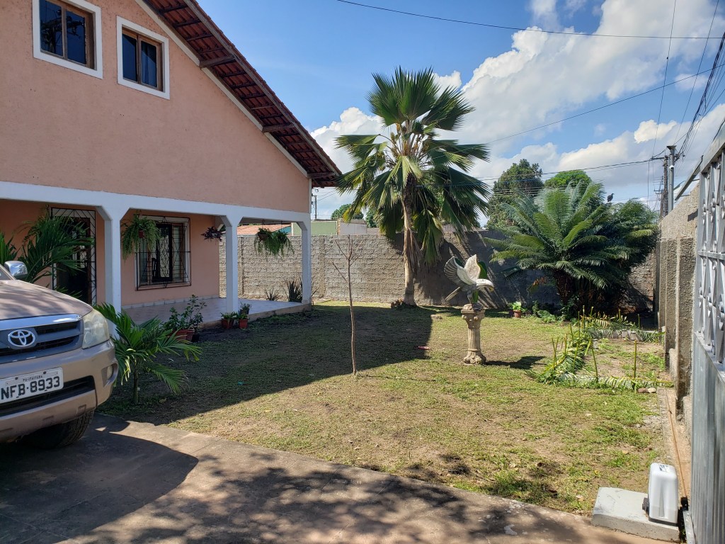 Front of the house. It's painted pink with white trim.